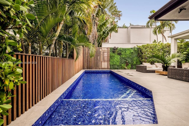 view of swimming pool featuring a patio