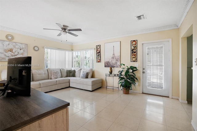 living room with ceiling fan, light tile patterned flooring, and crown molding