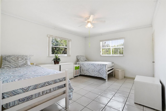 bedroom with multiple windows, ceiling fan, crown molding, and light tile patterned floors