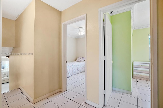 hall with light tile patterned flooring