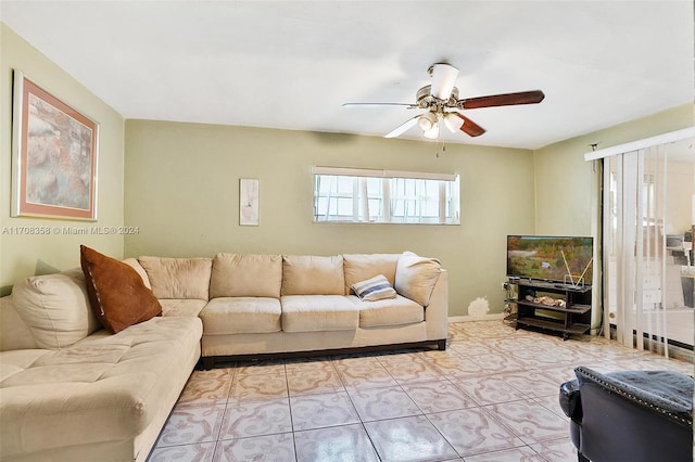 living room featuring ceiling fan and light tile patterned flooring