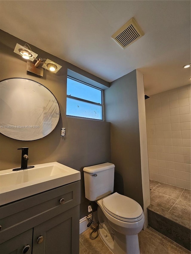 3600 NE 170th St Unit 402, North Miami Beach, FL 33160 - bathroom featuring tiled shower, vanity, and tile patterned floors