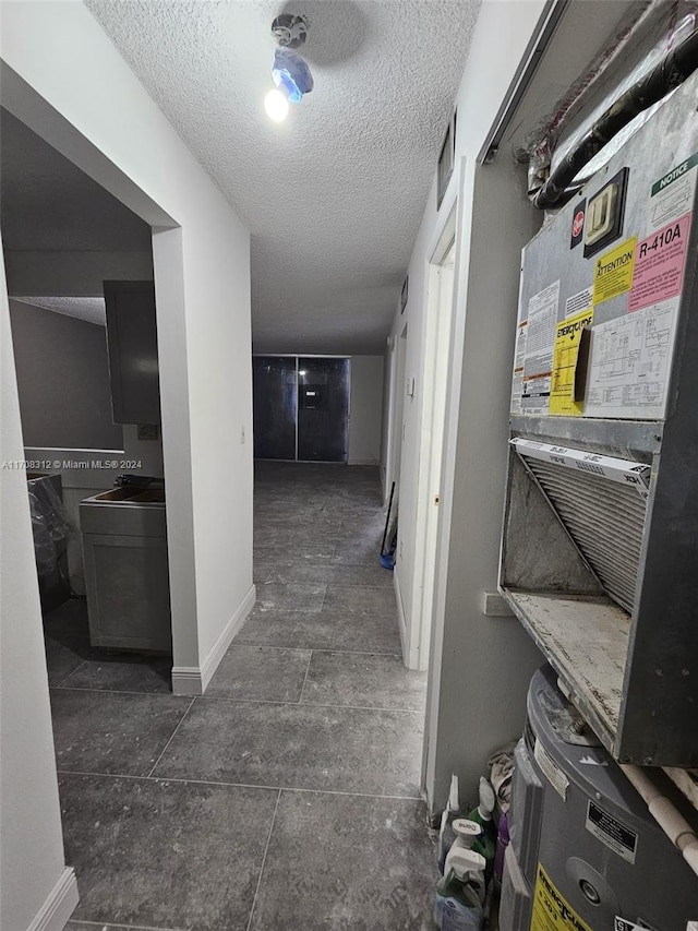 hallway featuring a textured ceiling