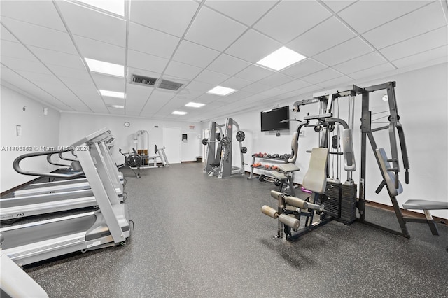 gym featuring a paneled ceiling