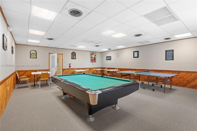 recreation room featuring carpet flooring, a paneled ceiling, wood walls, and billiards