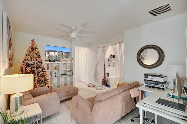 living area featuring ceiling fan, visible vents, and light tile patterned flooring