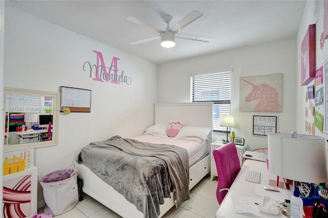 tiled bedroom featuring a ceiling fan