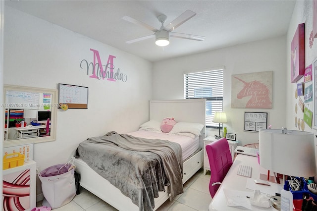 tiled bedroom with a ceiling fan