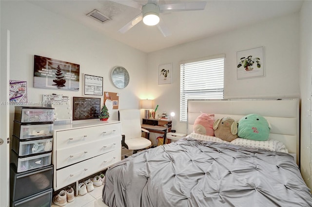 bedroom with visible vents, ceiling fan, and tile patterned flooring