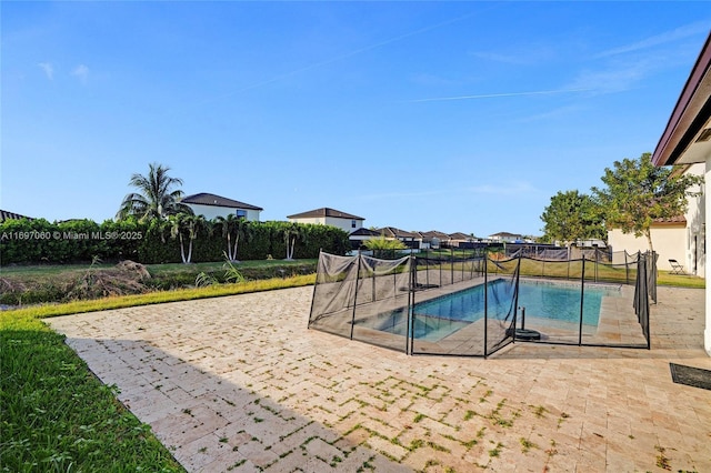 view of pool featuring a patio, fence, and a fenced in pool