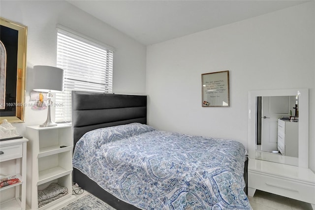 bedroom with tile patterned floors