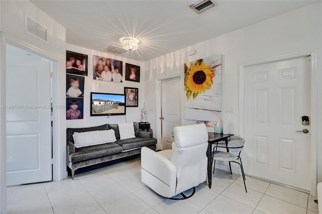 living area with light tile patterned floors and visible vents