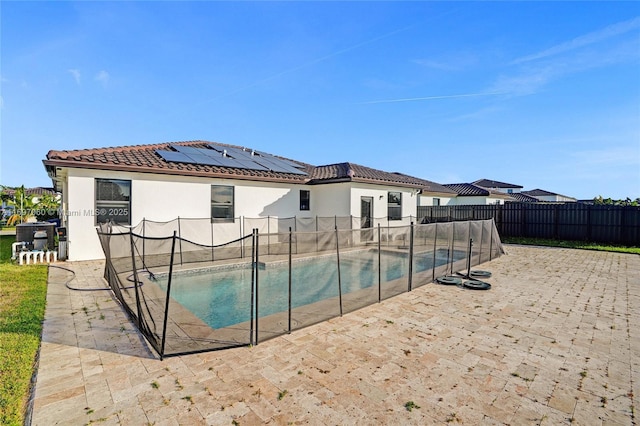 view of pool with a patio, a fenced in pool, and a fenced backyard