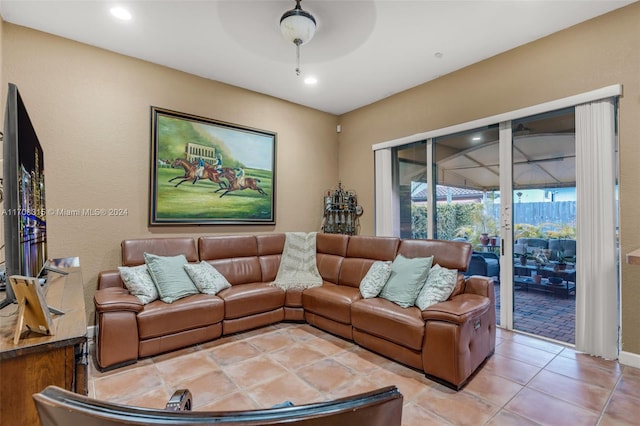 tiled living room featuring ceiling fan