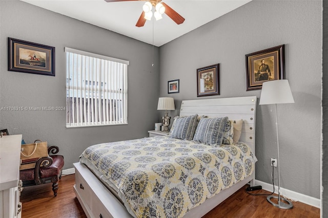 bedroom featuring ceiling fan and dark wood-type flooring