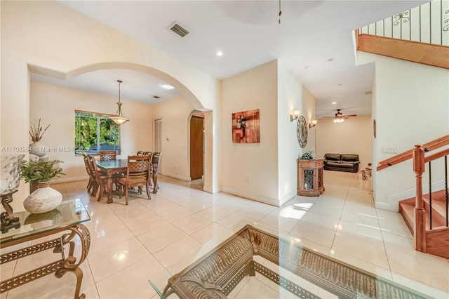 interior space featuring ceiling fan and light tile patterned floors