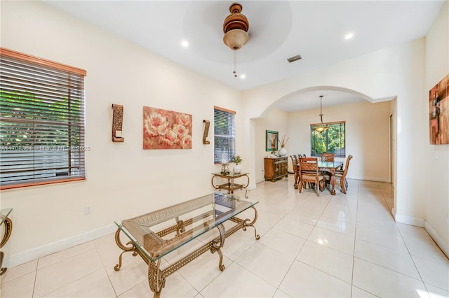 2913 SW 13th St, Miami, FL 33145 - living room featuring arched walkways, a ceiling fan, recessed lighting, light tile patterned flooring, and baseboards