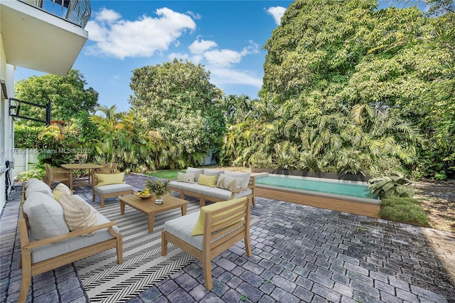 view of patio / terrace featuring a balcony and an outdoor hangout area