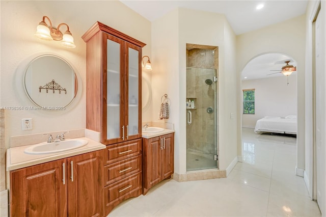 2913 SW 13th St, Miami, FL 33145 - full bath with double vanity, a shower stall, tile patterned flooring, connected bathroom, and ceiling fan
