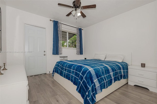 bedroom with ceiling fan and light hardwood / wood-style flooring