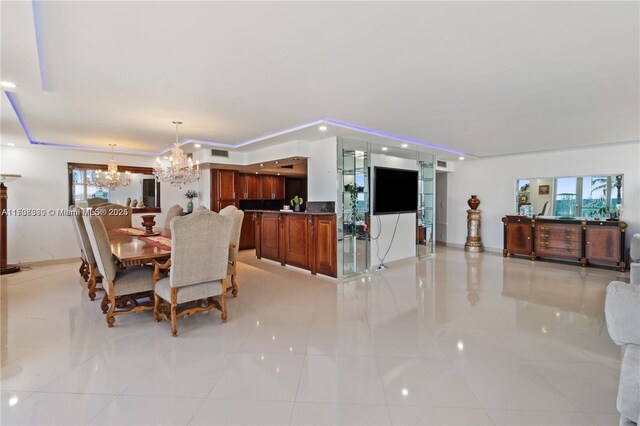 dining room with light tile patterned floors and an inviting chandelier