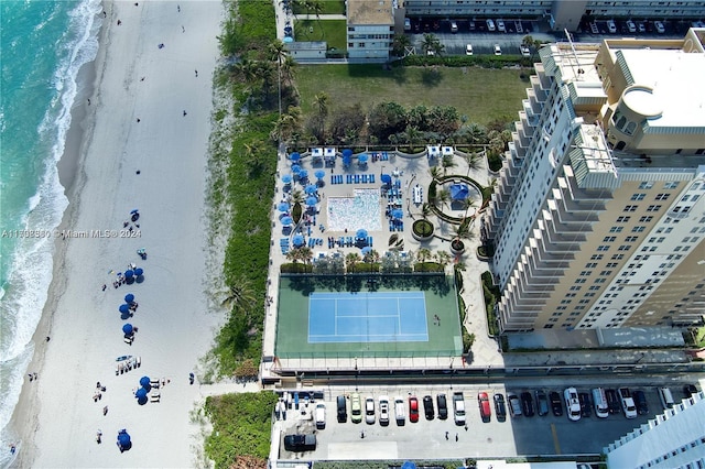 aerial view with a water view and a beach view