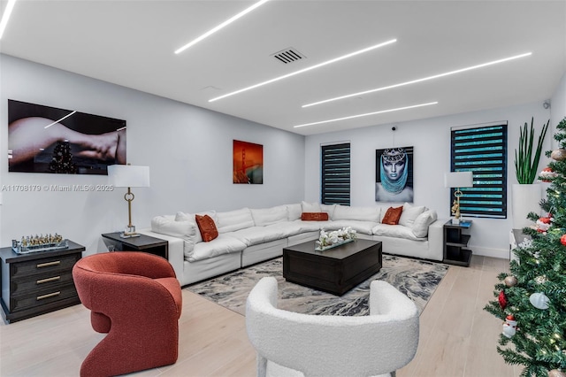 living room with light hardwood / wood-style flooring