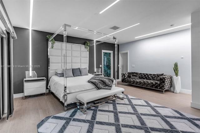 bedroom featuring hardwood / wood-style floors