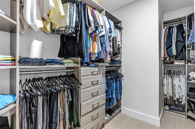 spacious closet with light wood-type flooring