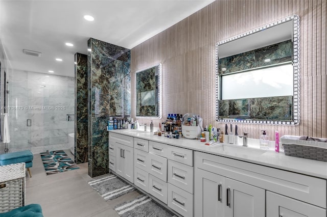 full bathroom with recessed lighting, a sink, a shower stall, and double vanity