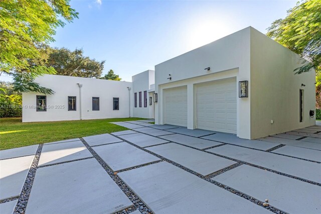 1120 Wallace St, Coral Gables, FL 33134 - view of front of home featuring stucco siding, a garage, and a front yard
