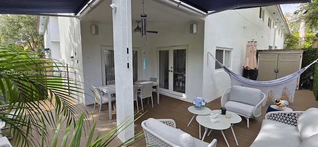 view of patio / terrace with a wooden deck and french doors