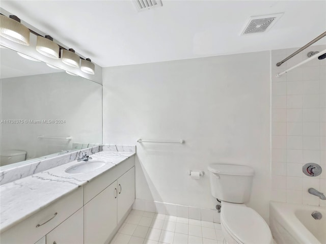 full bathroom with tile patterned flooring, vanity, toilet, and tiled shower / bath