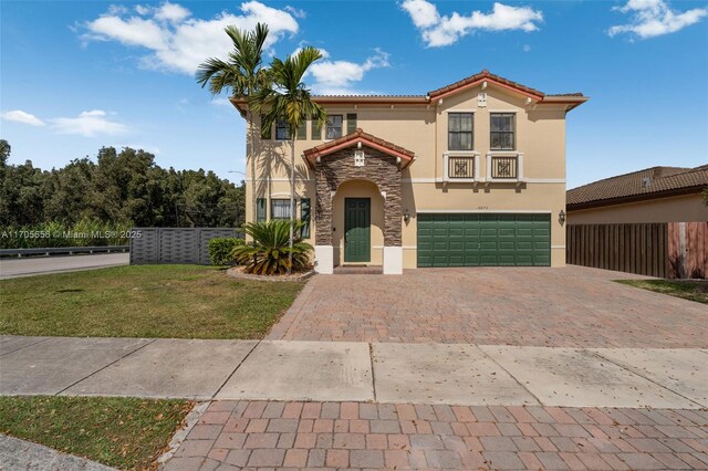 mediterranean / spanish-style house featuring a garage