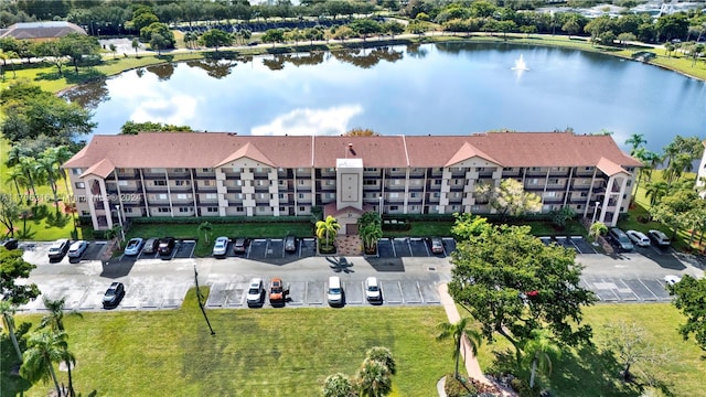 birds eye view of property with a water view