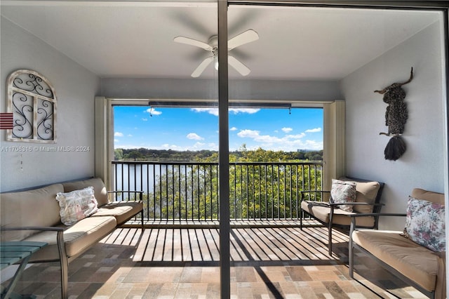 sunroom featuring ceiling fan and a healthy amount of sunlight