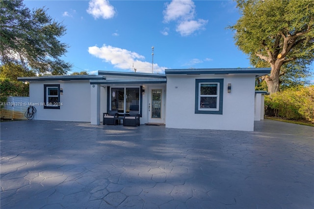 back of property featuring a patio