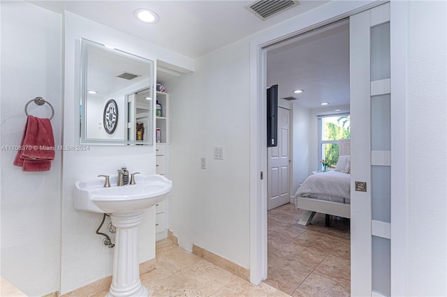 bathroom with tile patterned floors