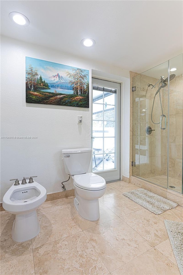 bathroom featuring tile patterned flooring, a bidet, an enclosed shower, and toilet