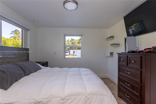 bedroom with light tile patterned floors