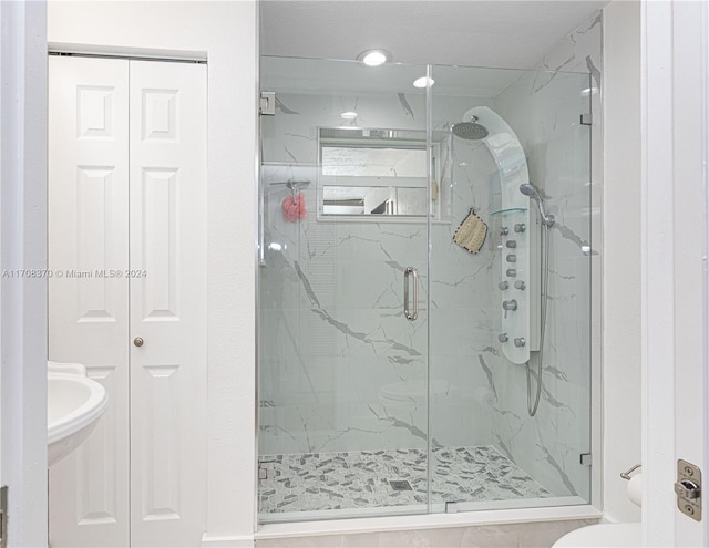 bathroom featuring an enclosed shower