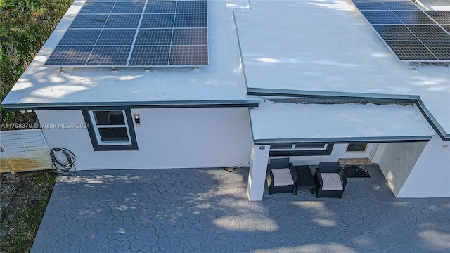 exterior space featuring a patio and solar panels