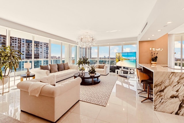 living room with recessed lighting, visible vents, expansive windows, light tile patterned flooring, and a chandelier