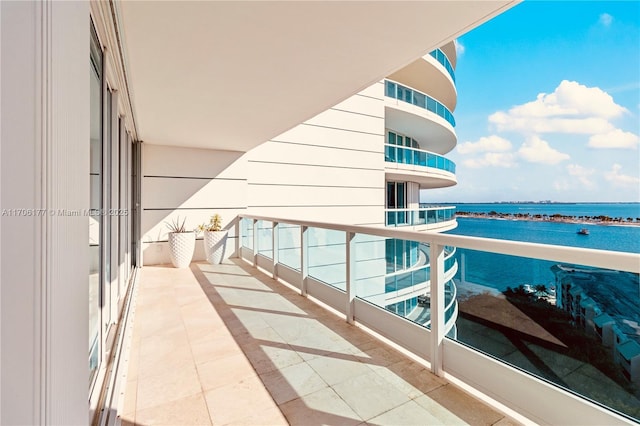 balcony featuring a water view