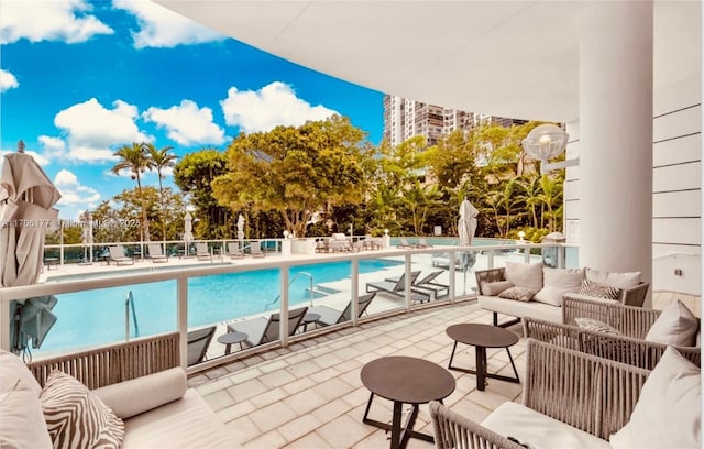 community pool featuring a patio and outdoor lounge area