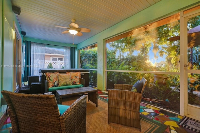 sunroom / solarium featuring ceiling fan