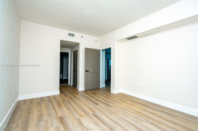 empty room with light wood-type flooring