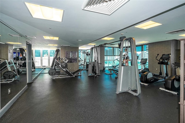 exercise room featuring vaulted ceiling