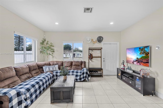 living room with light tile patterned floors and plenty of natural light