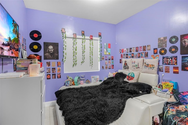 bedroom with light tile patterned floors